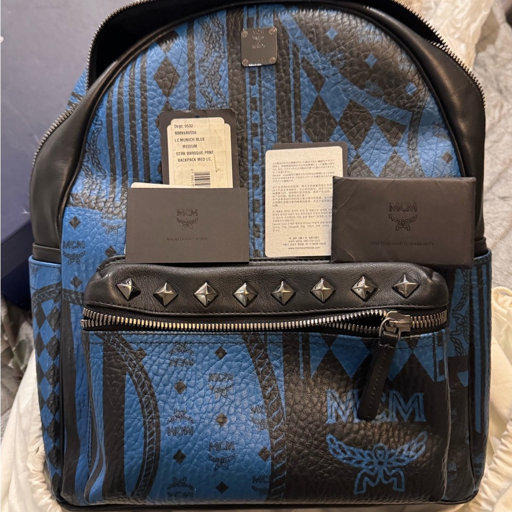 MCM Blue and Black Backpack with Textured Material and Bold Pattern